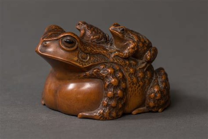 What do frogs symbolize in Japanese culture?