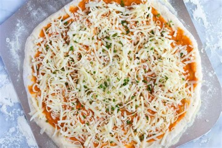Why does Detroit pizza have sauce on top?